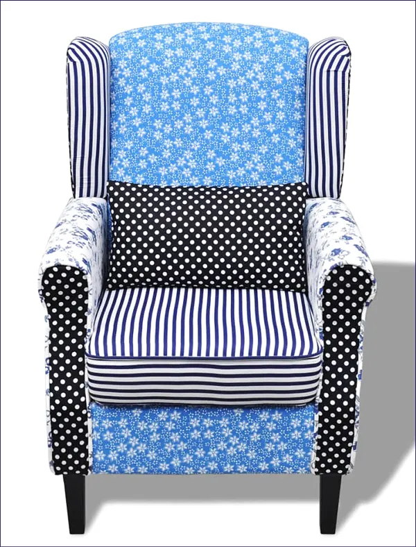 Niebieski fotel uszak typu patchwork Charlene